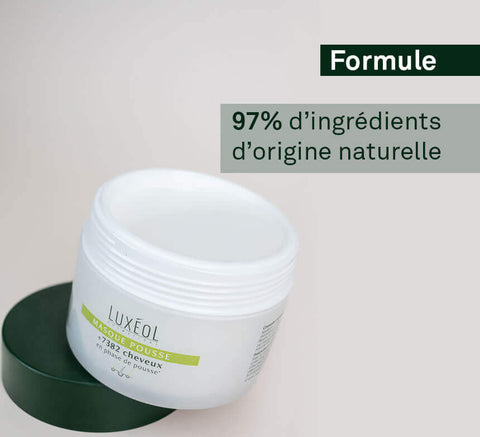 White jar of Luxéol Masque Pousse hair growth mask, open with a dark green lid resting next to it, text "Formule 97% d'ingrédients d'origine naturelle" is printed over the jar.