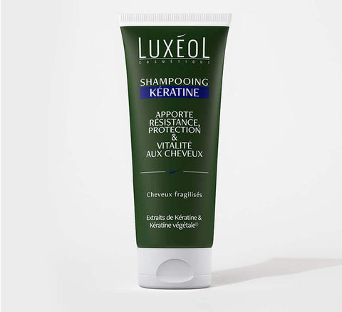 Luxéol Keratin Shampoo 200 ml tube on minimal background for fragile hair strength and vitality.