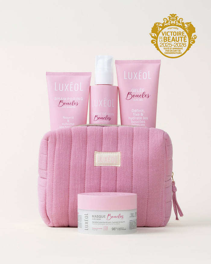 Luxueux hair care products with pink packaging on a white background, featuring the Luxeol brand.
